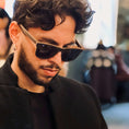 Load image into Gallery viewer, A man with curly hair wearing Wenge wood sunglasses.