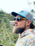 Load image into Gallery viewer, A bearded man in a hat and Yellowheart wood sunglasses.
