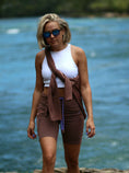 Load image into Gallery viewer, Image of a woman in white tank top and brown shorts, wearing trendy Wenge wood sunglasses.
